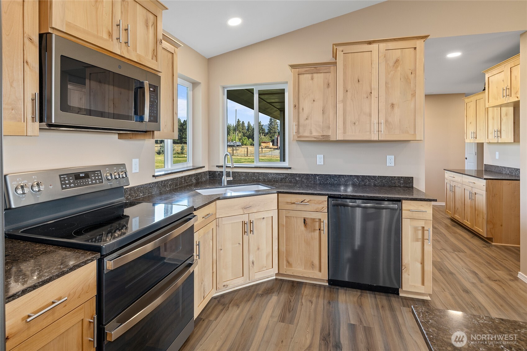 491 Pease Road Cle Elum, WA 98922 - Photo 10 of 38 a kitchen with stainless steel appliances granite countertop wooden cabinets stove top oven and sink