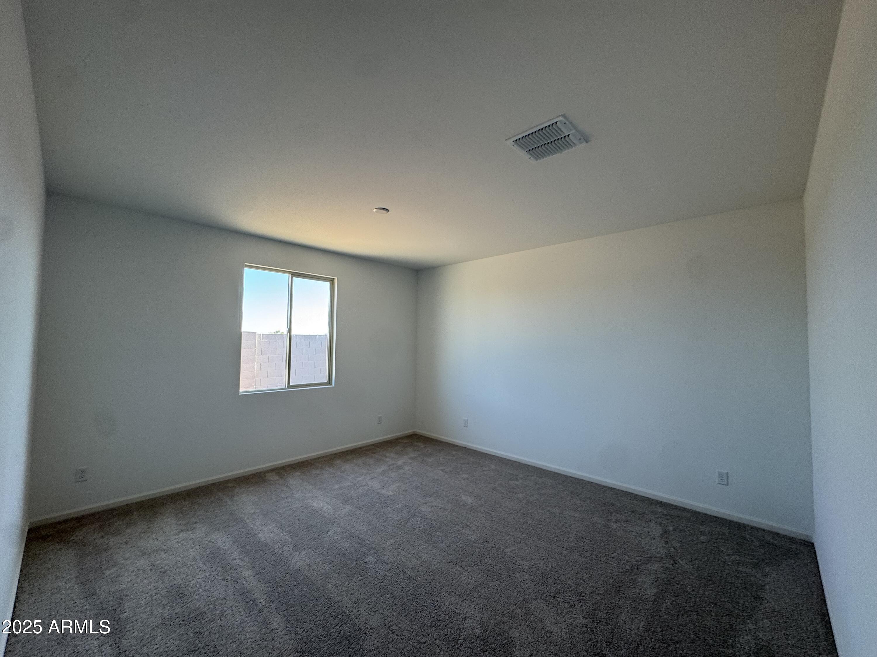 16181 West Bajada Road Surprise, AZ 85387 - Photo 11 of 21 a view of an empty room with a window