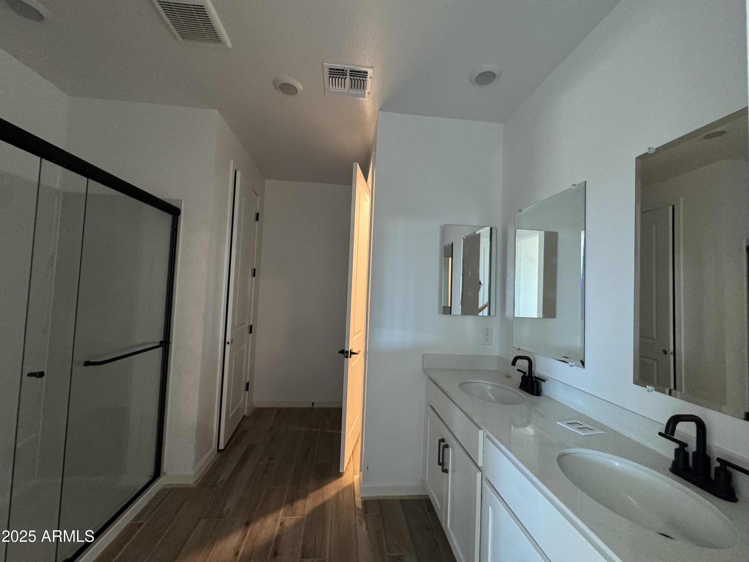 16181 West Bajada Road Surprise, AZ 85387 - Photo 12 of 21 a bathroom with a sink and a mirror