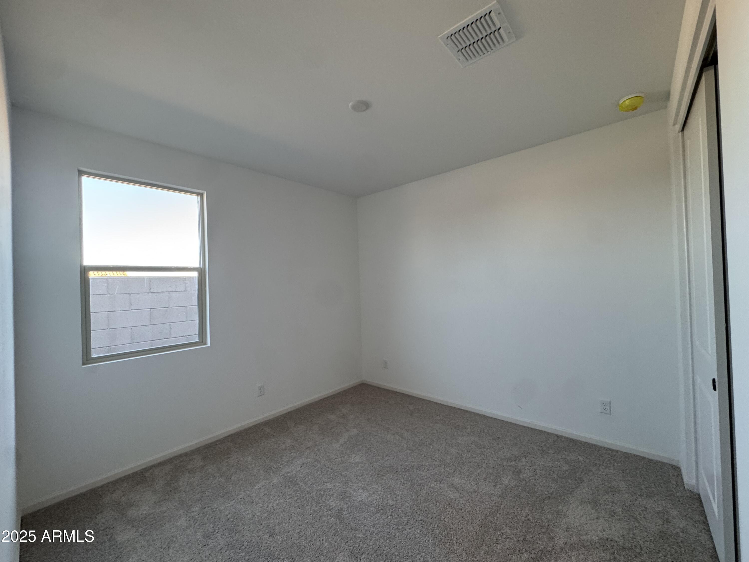 16181 West Bajada Road Surprise, AZ 85387 - Photo 5 of 21 an empty room with a window
