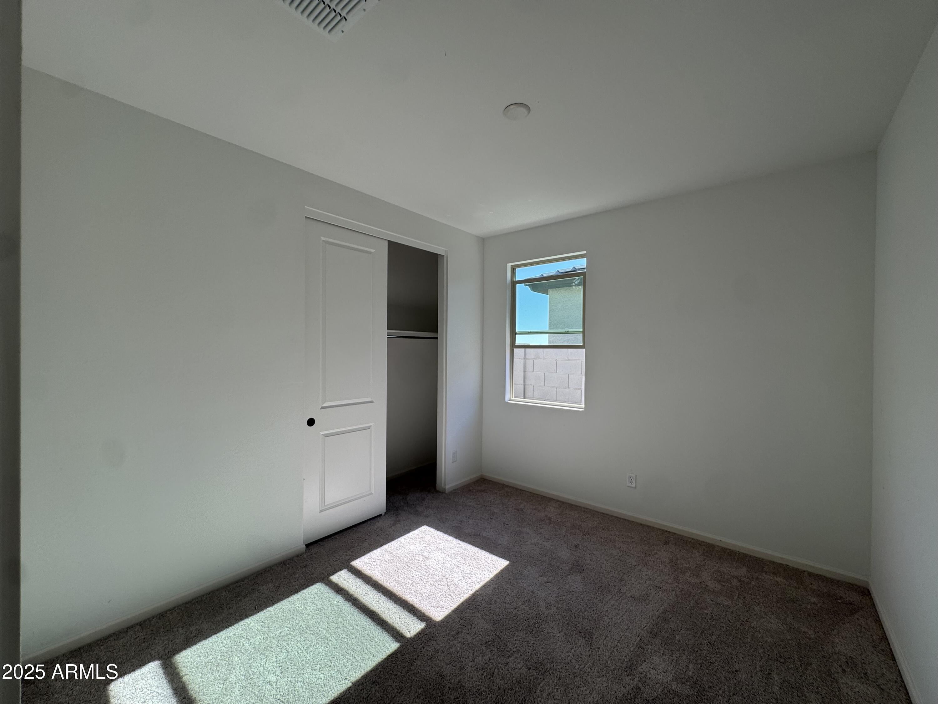 16181 West Bajada Road Surprise, AZ 85387 - Photo 9 of 21 a view of an empty room and window