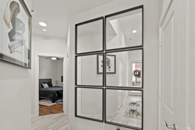 a view of hallway with wooden floor