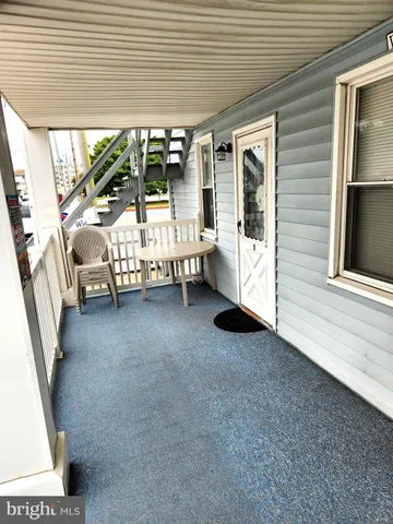 a view of an outdoor space with porch and patio
