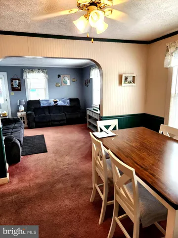 a kitchen with a table and chairs