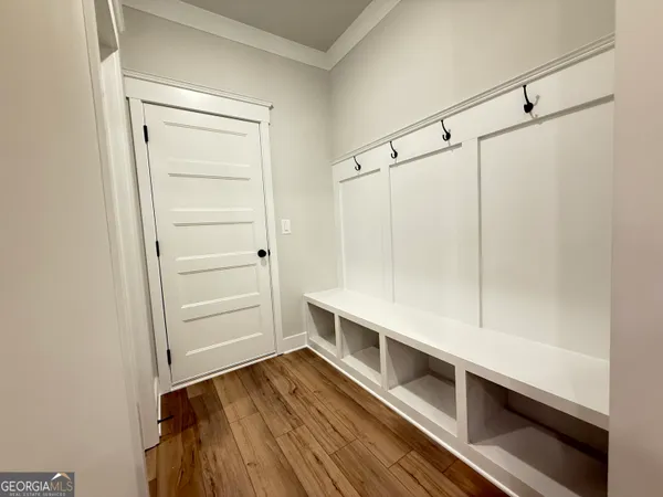 a spacious bathroom with a granite countertop sink a mirror a vanity and a shower