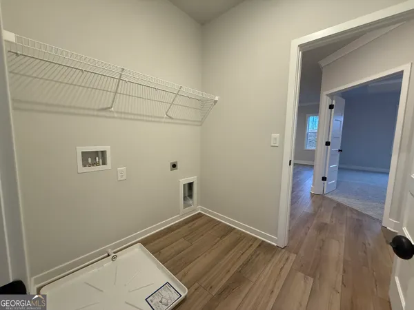 a front view of a building with a garden