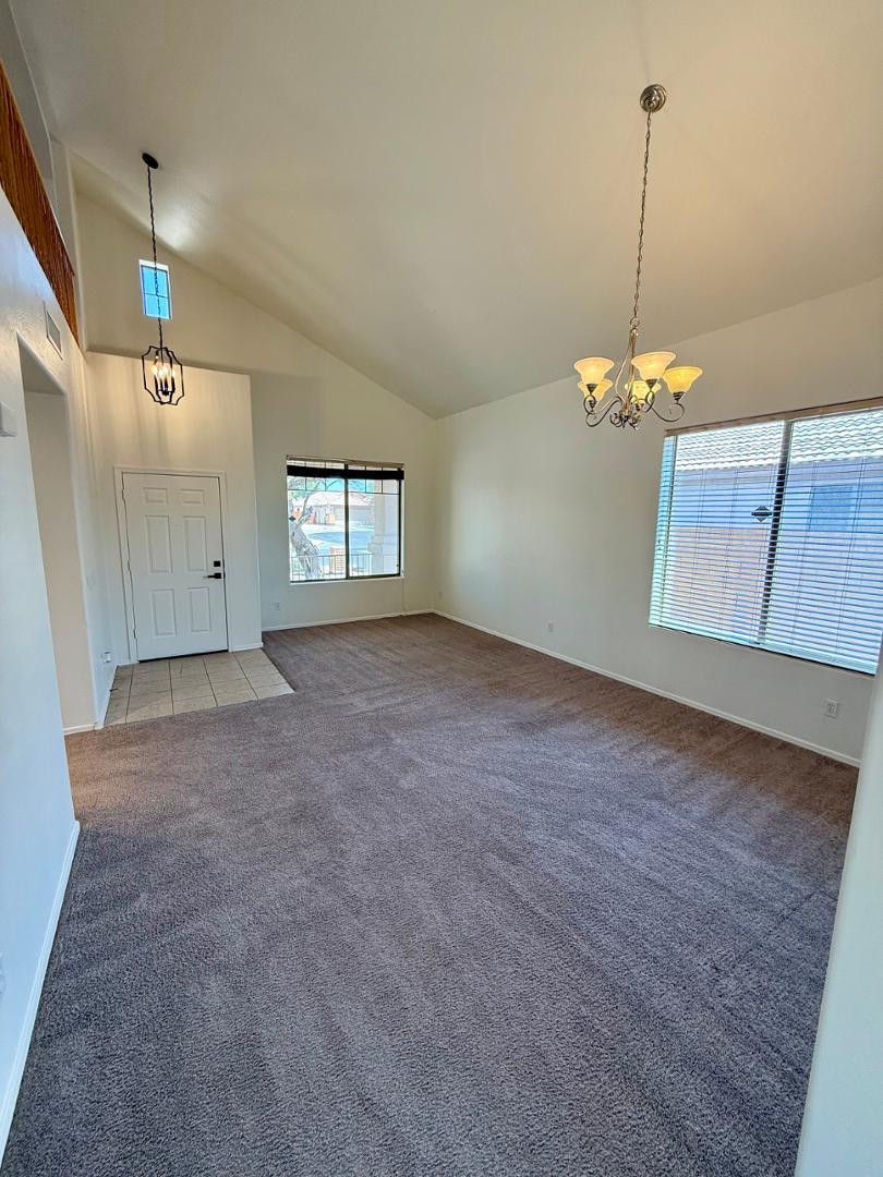 4319 West Darrel Road Laveen, AZ 85339 - Photo 4 of 16 a view of a room with window and chandelier