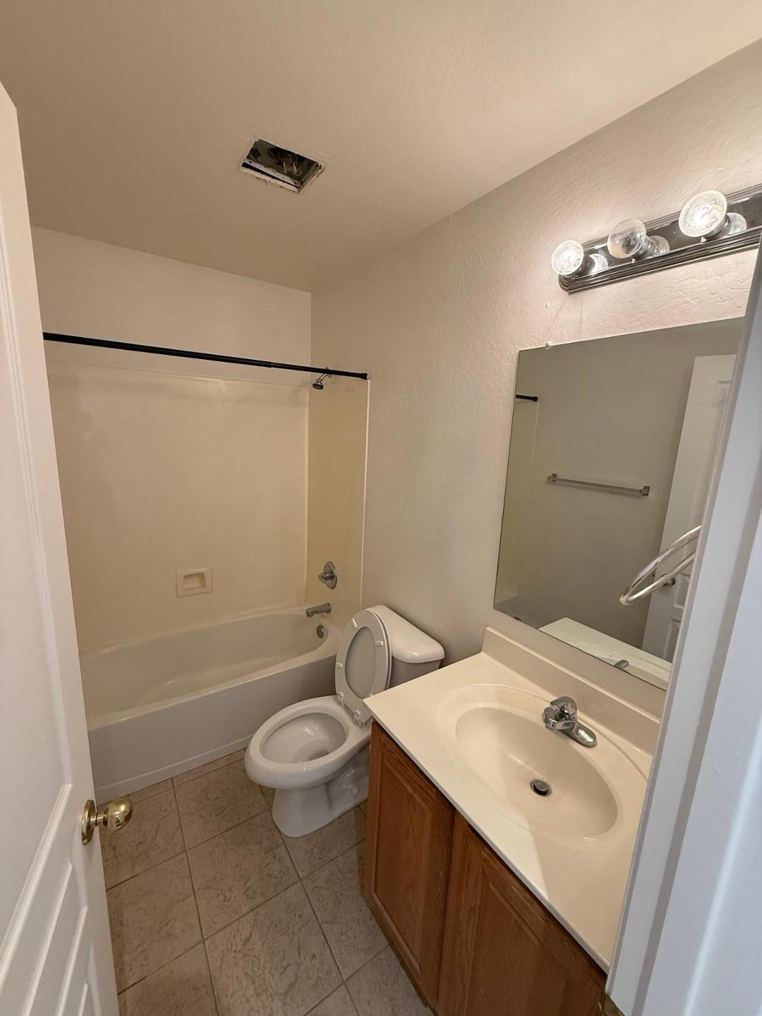 4319 West Darrel Road Laveen, AZ 85339 - Photo 7 of 16 a bathroom with a sink a toilet and shower