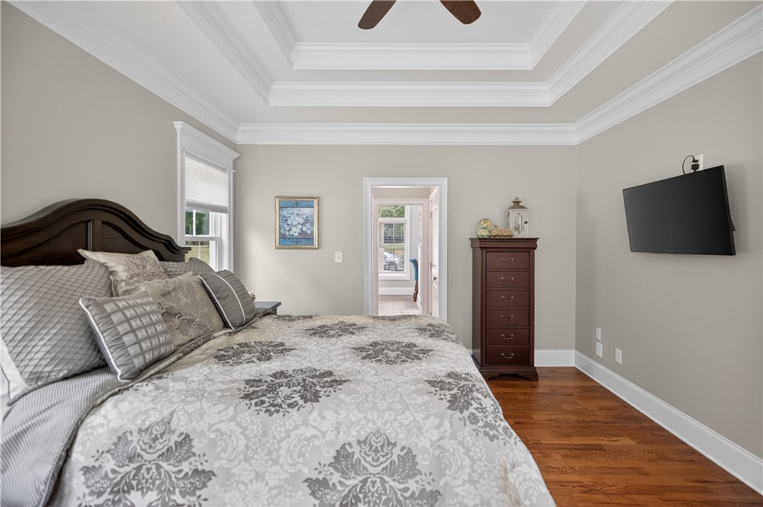 206 James Hare Road Anderson, SC 29626 - Photo 35 of 37 An inviting sleeping chamber features tiered tray ceilings and rich hardwood flooring throughout.
