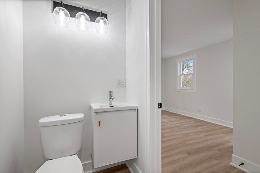 8330 45th Street Lyons, IL 60534 - Photo 11 of 26 a bathroom with a toilet