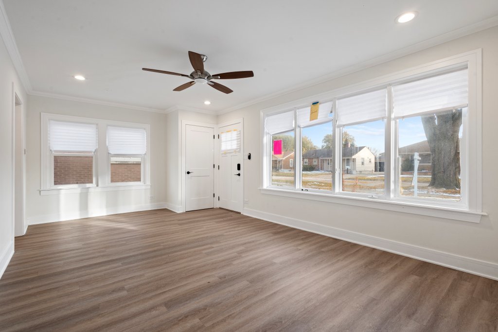 8330 45th Street Lyons, IL 60534 - Photo 20 of 26 a view of an empty room with a window and wooden floor
