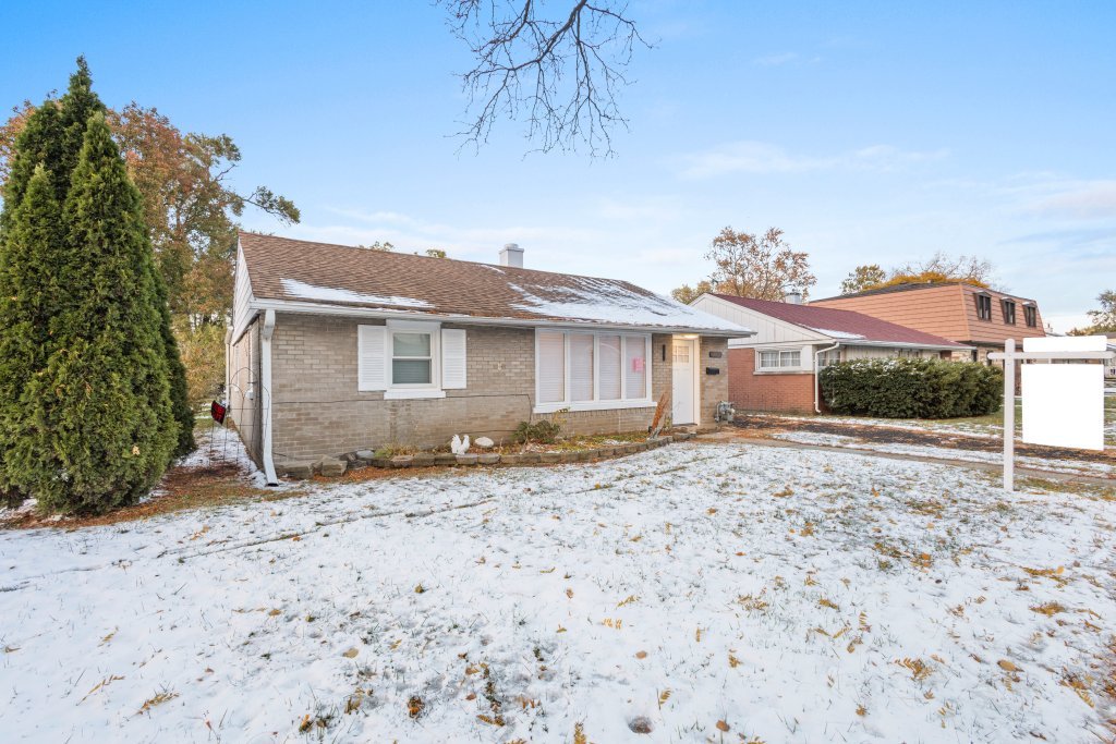 8330 45th Street Lyons, IL 60534 - Photo 2 of 26 a front view of a house with a yard