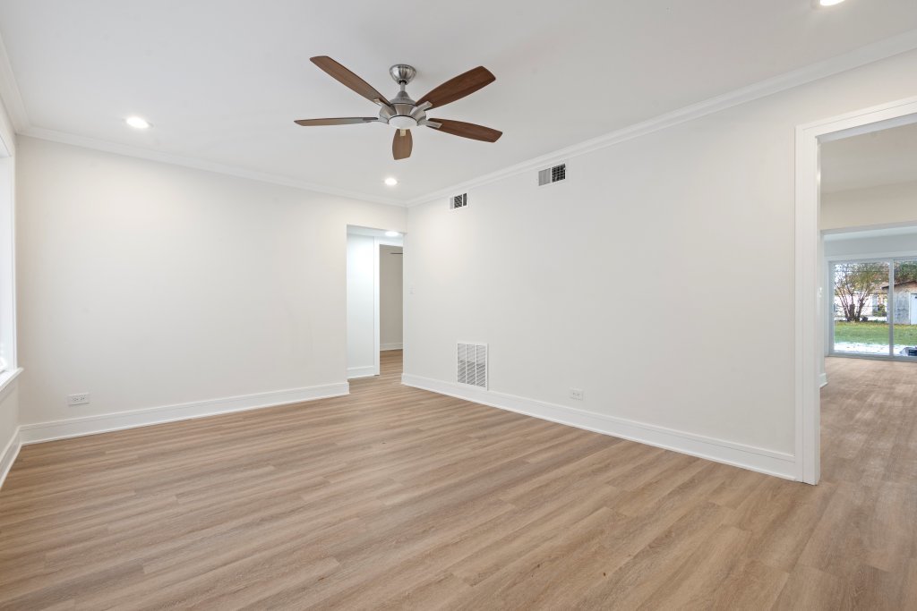 8330 45th Street Lyons, IL 60534 - Photo 22 of 26 an empty room with wooden floor and windows