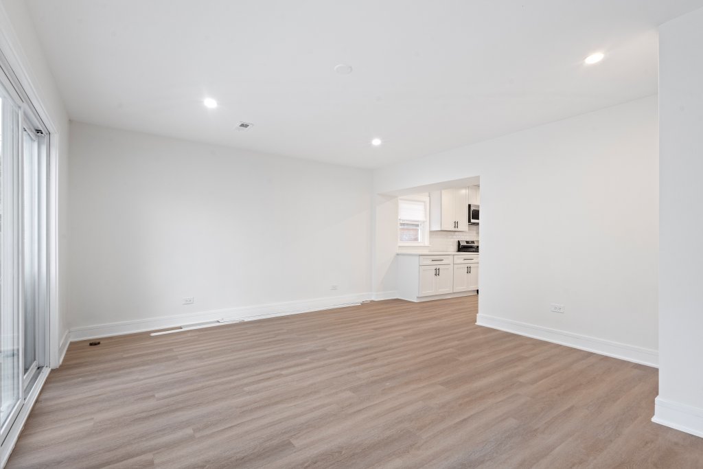 8330 45th Street Lyons, IL 60534 - Photo 9 of 26 a view of a kitchen with wooden floor and a window
