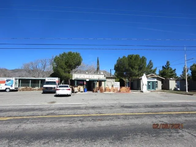 a view of a cars park on the side of road