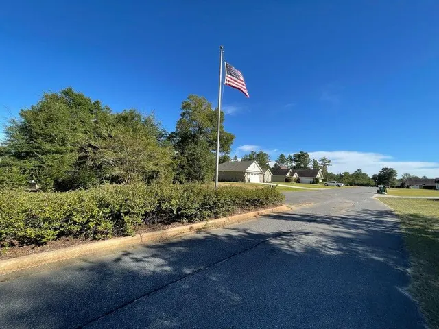 a view of a road with a building in the background