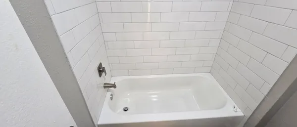 a close up of a bathtub in a bathroom
