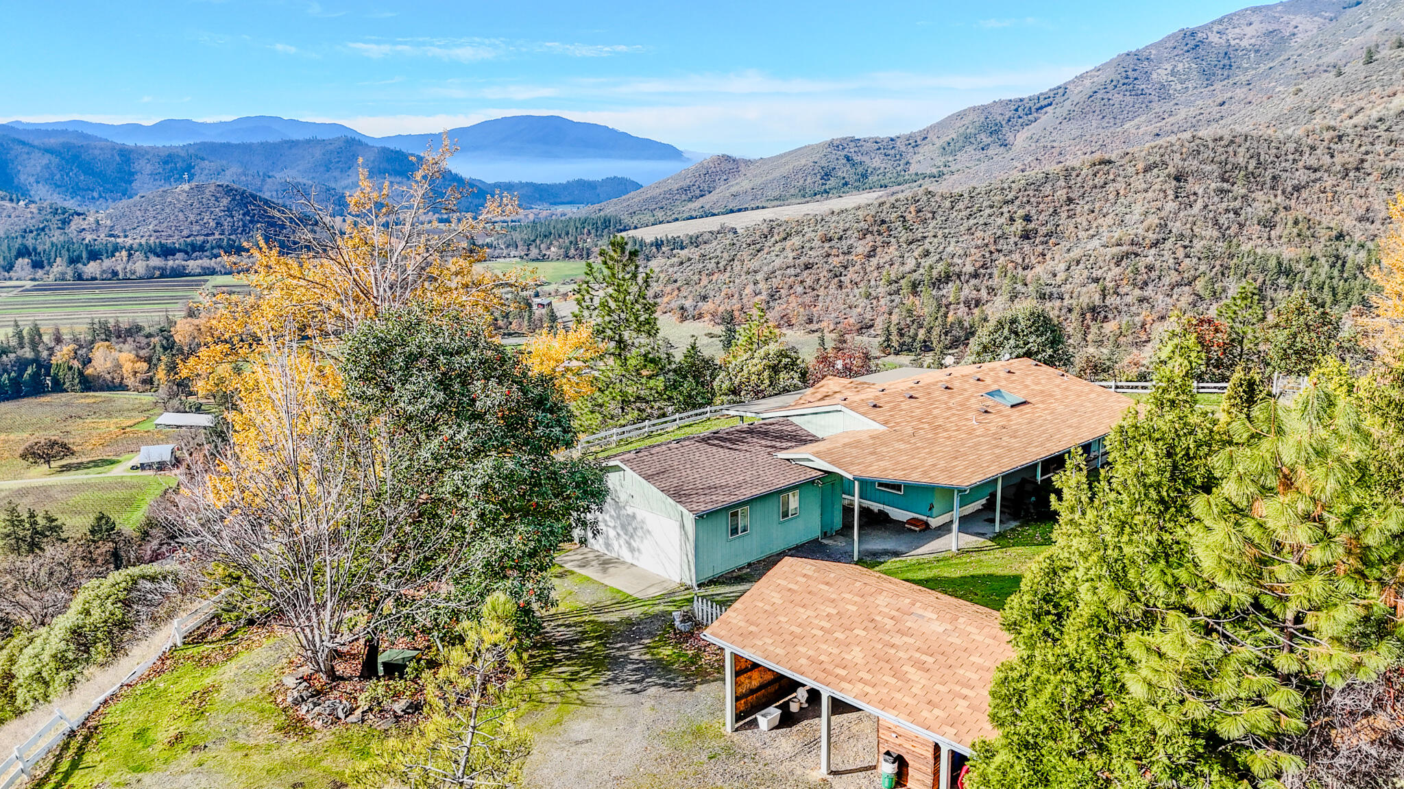 362 Humbug Creek Road Jacksonville, OR 97530 - Photo 4 of 49 an aerial view of a house with a mountain