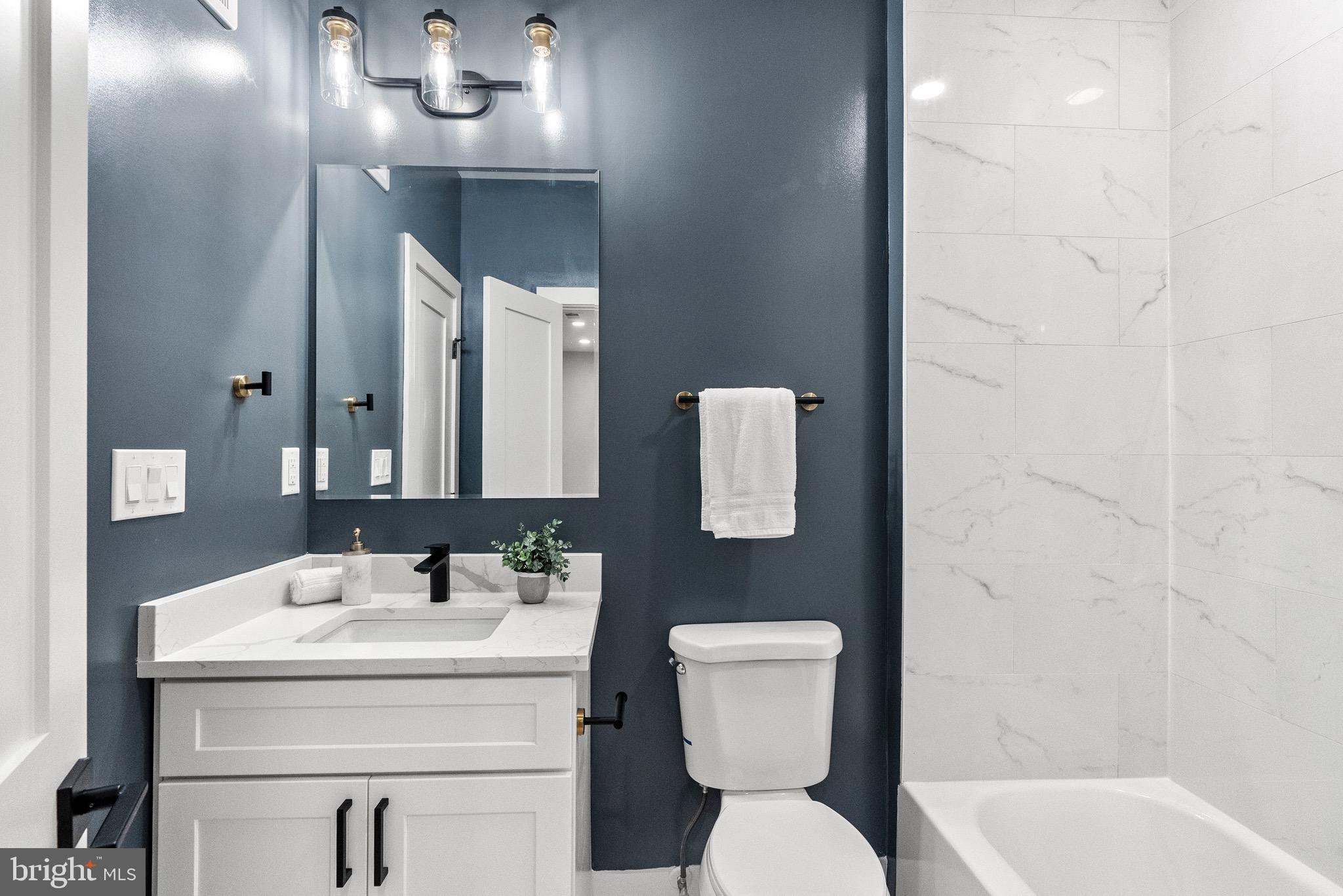 2019 M Street Northeast, Unit 1 Washington, DC 20002 - Photo 15 of 31 a bathroom with a sink toilet and shower