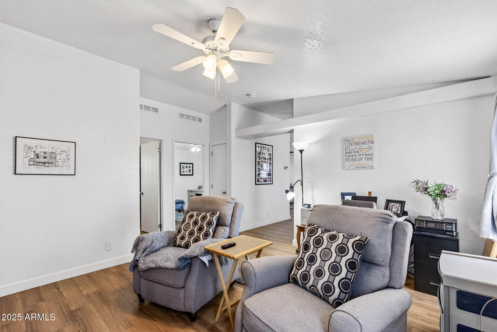 16101 North El Mirage Road, Unit 353 El Mirage, AZ 85335 - Photo 16 of 46 a living room with furniture and a wooden floor