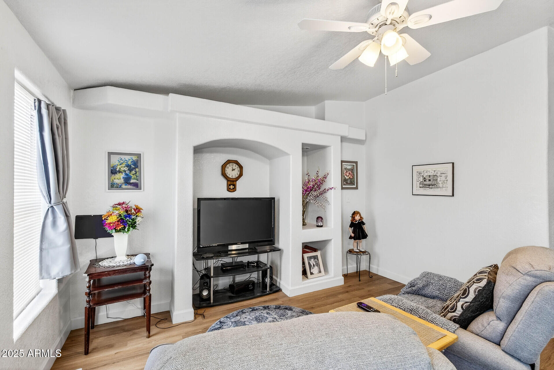 16101 North El Mirage Road, Unit 353 El Mirage, AZ 85335 - Photo 17 of 46 a living room with furniture and a flat screen tv