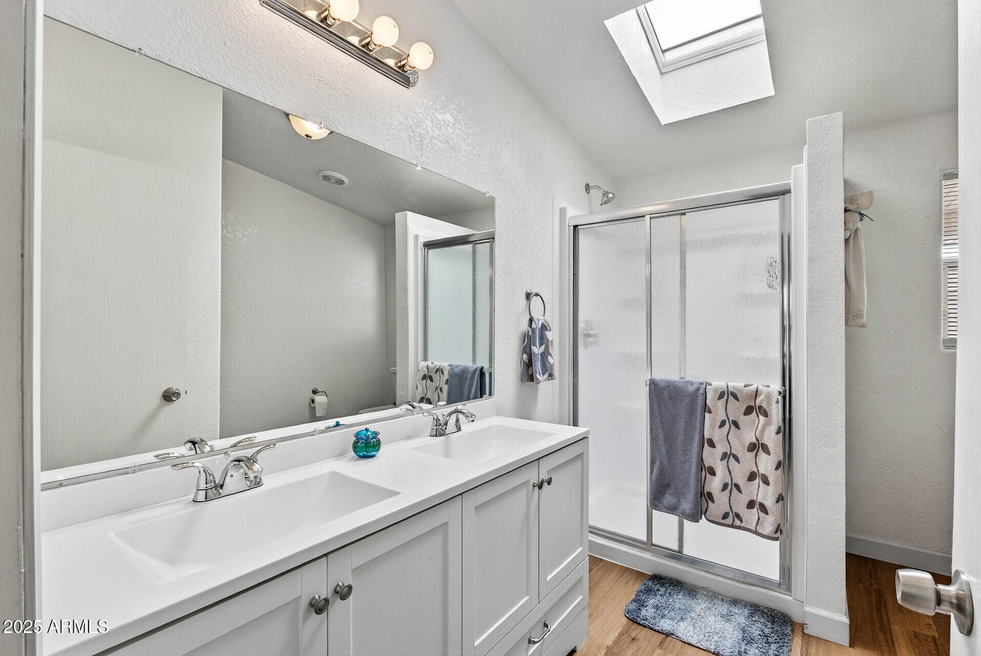 16101 North El Mirage Road, Unit 353 El Mirage, AZ 85335 - Photo 22 of 46 a bathroom with a double vanity sink mirror and double