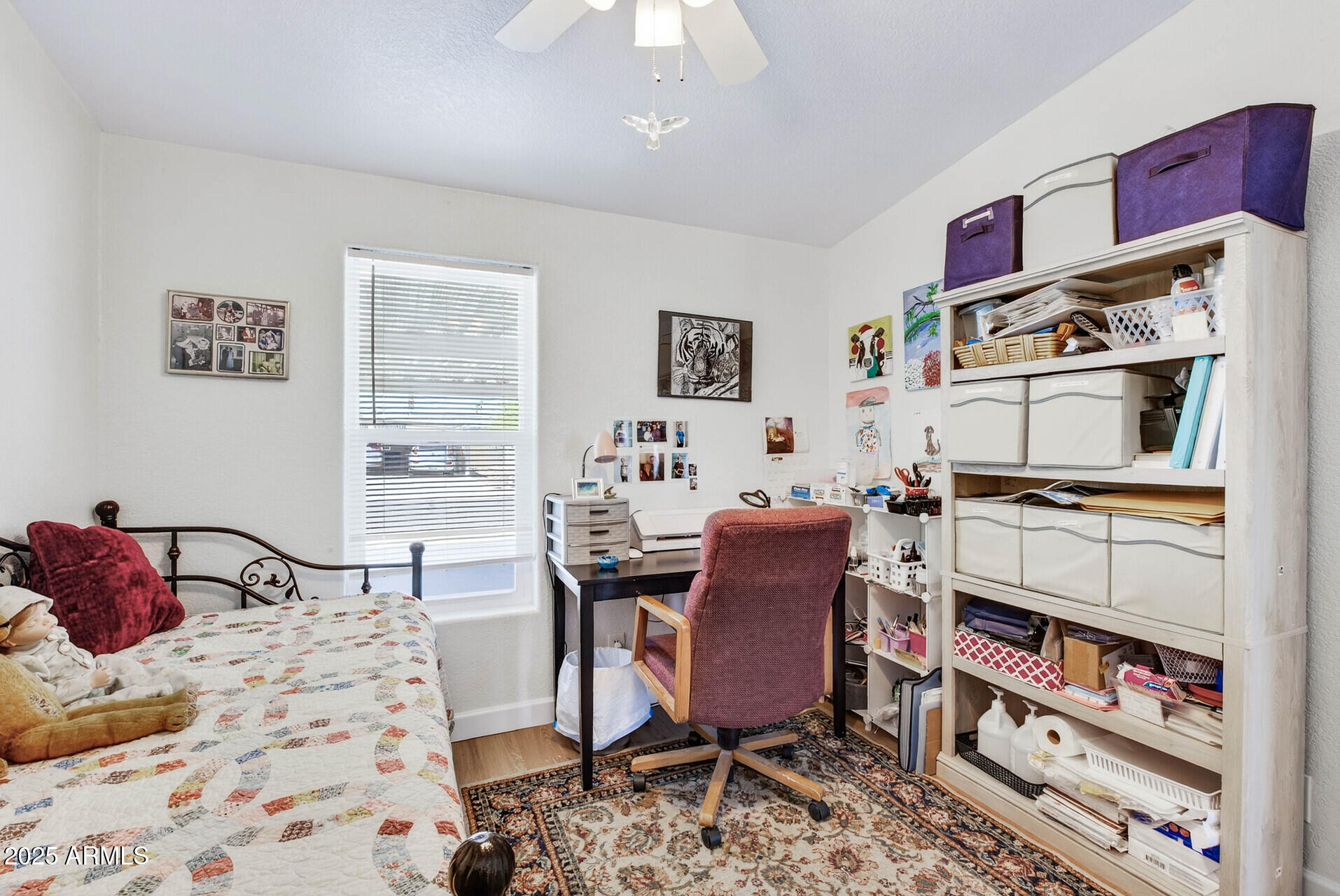 16101 North El Mirage Road, Unit 353 El Mirage, AZ 85335 - Photo 29 of 46 a bedroom with furniture and a book shelf