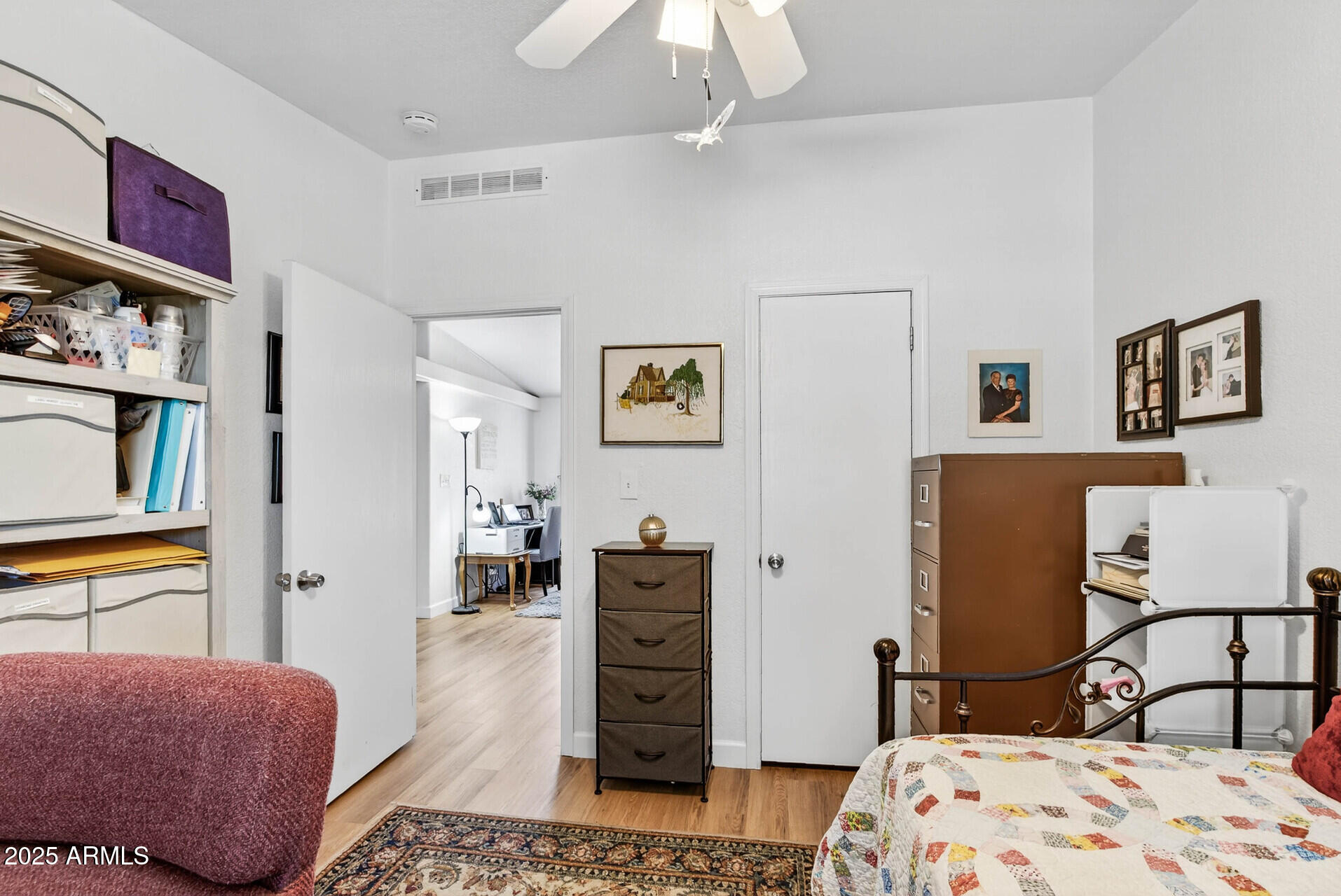 16101 North El Mirage Road, Unit 353 El Mirage, AZ 85335 - Photo 30 of 46 a bedroom with a bed dresser and a large mirror
