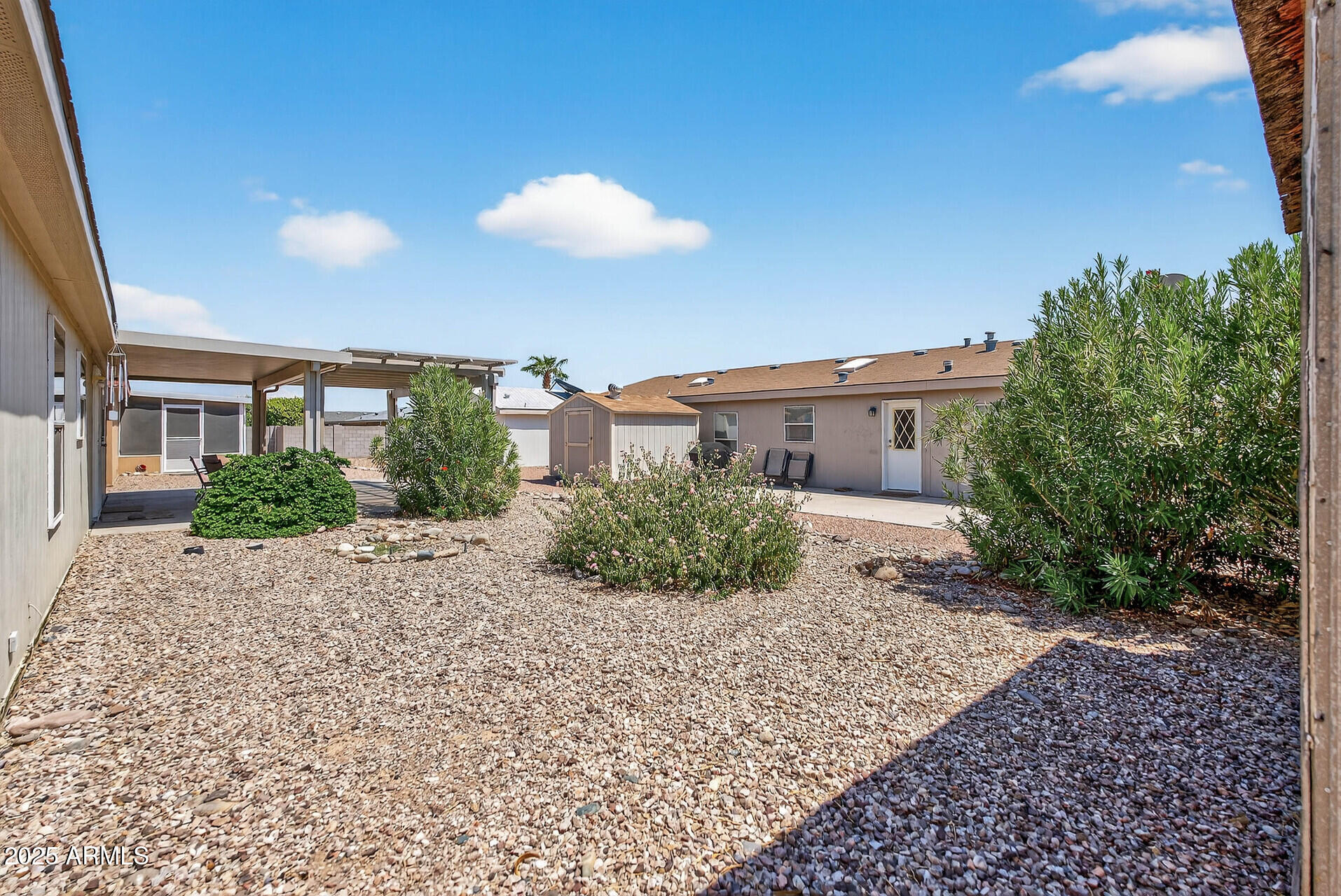 16101 North El Mirage Road, Unit 353 El Mirage, AZ 85335 - Photo 32 of 46 a view of a house with a patio