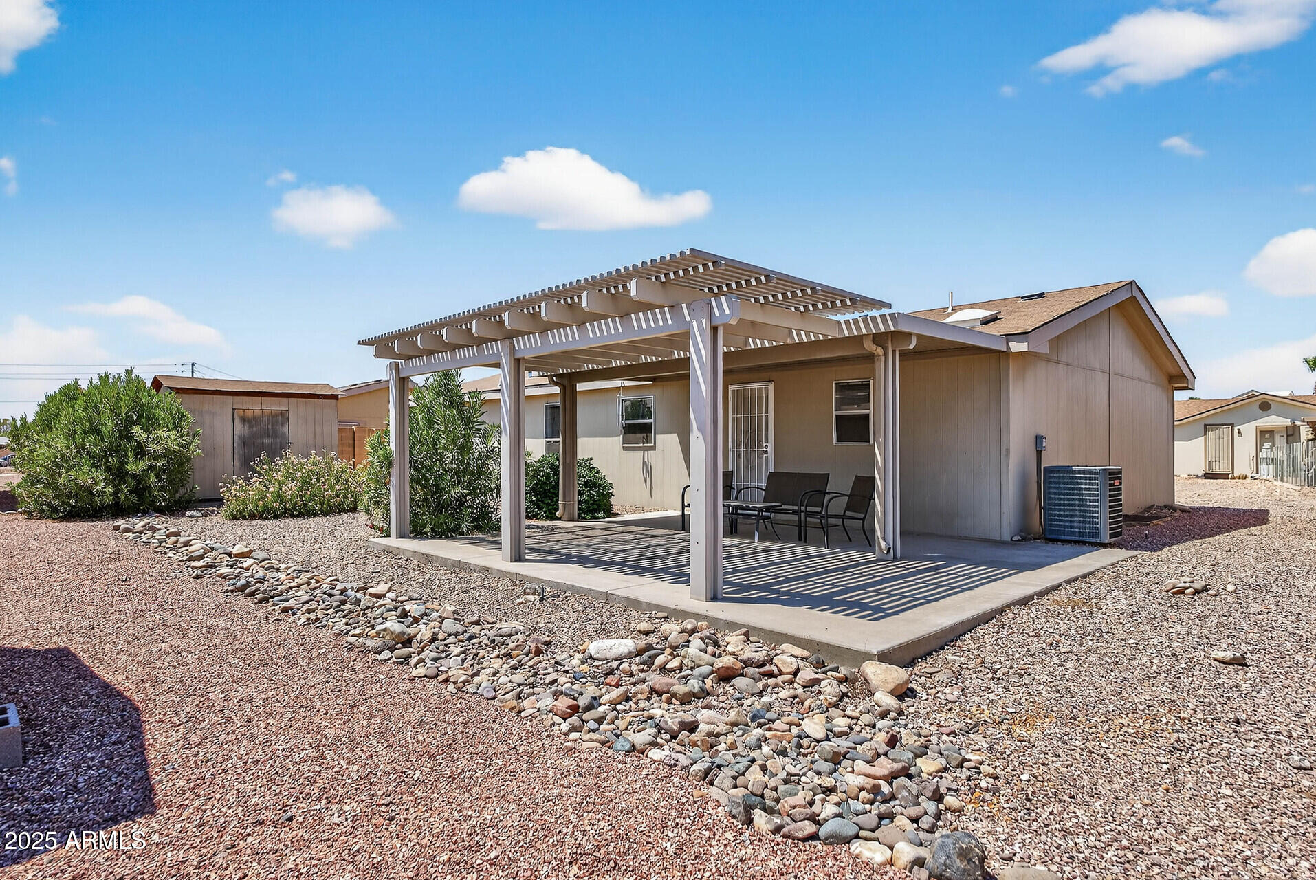16101 North El Mirage Road, Unit 353 El Mirage, AZ 85335 - Photo 35 of 46 a view of a house with a patio