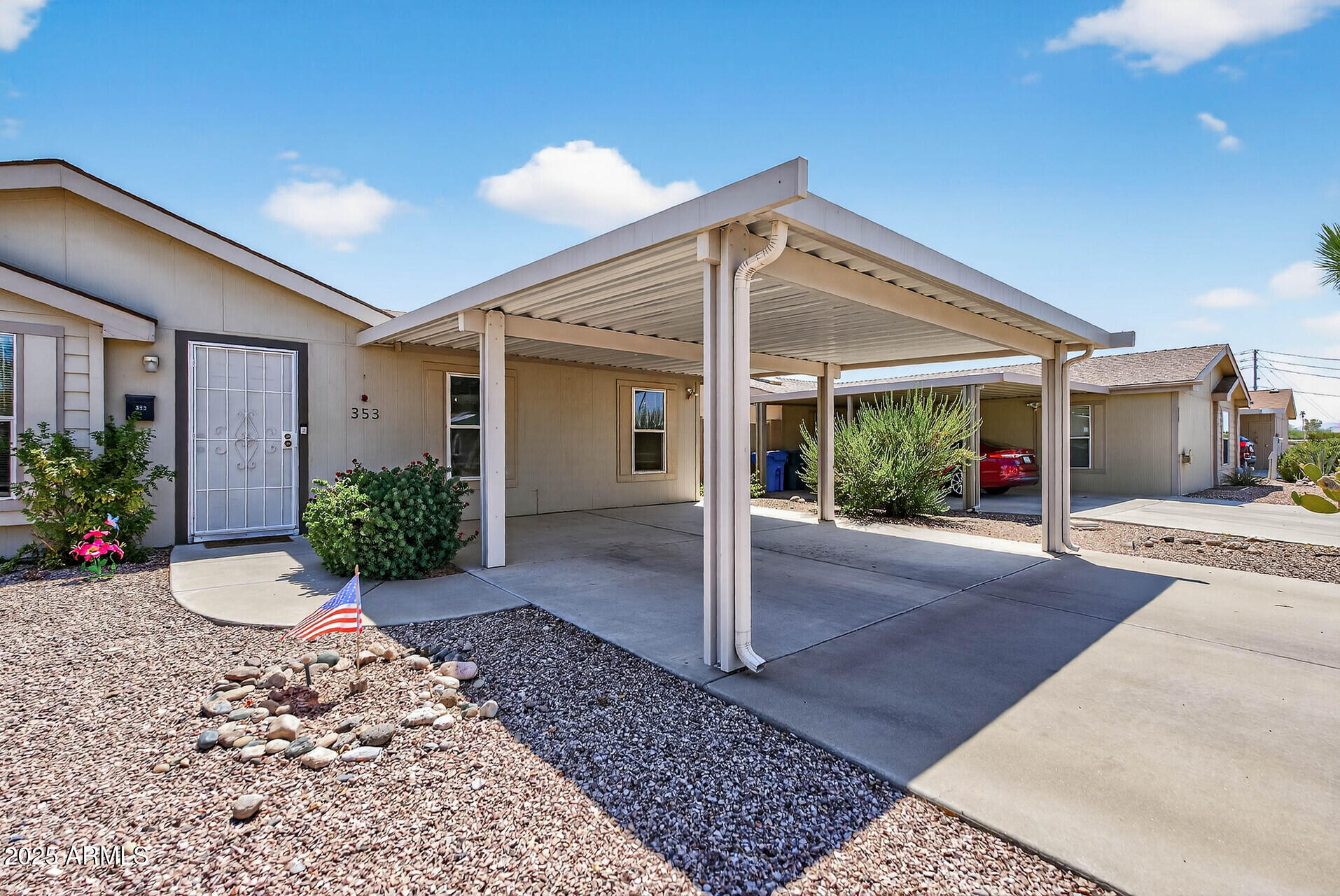 16101 North El Mirage Road, Unit 353 El Mirage, AZ 85335 - Photo 4 of 46 a view of a house with porch and garden