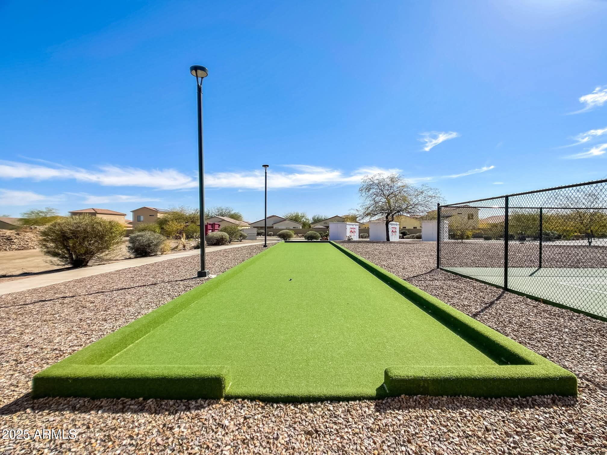 16101 North El Mirage Road, Unit 353 El Mirage, AZ 85335 - Photo 46 of 46 a view of a swimming pool with a lawn chairs