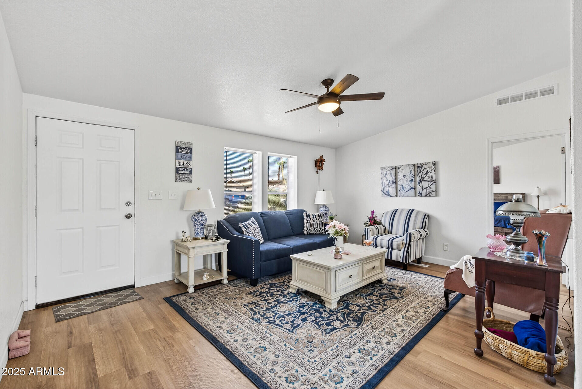 16101 North El Mirage Road, Unit 353 El Mirage, AZ 85335 - Photo 6 of 46 a living room with furniture and a rug