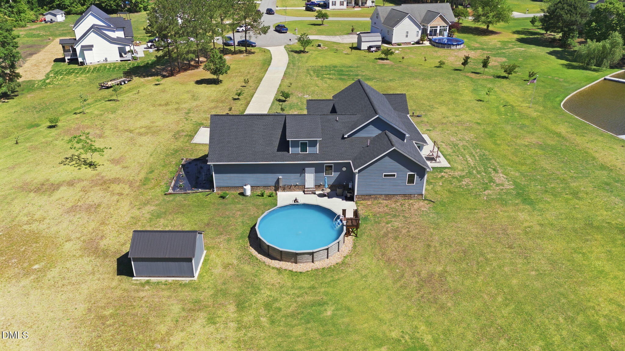 35 North Rippling Court Smithfield, NC 27577 - Photo 52 of 59 a aerial view of a house with swimming pool and large trees