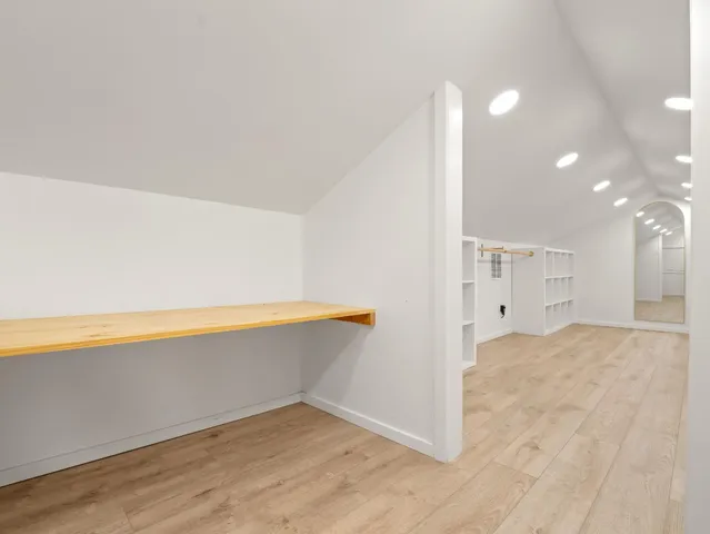 a view of a kitchen with a dishwasher and a refrigerator