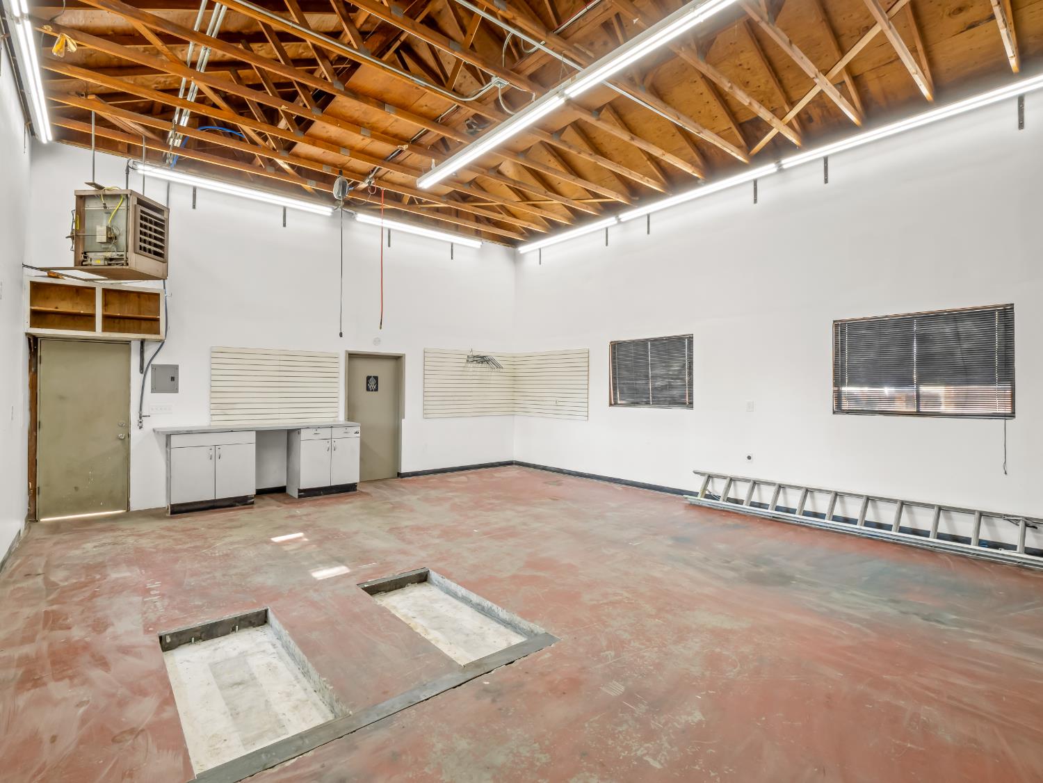 2980 Olive Street Selma, CA 93662 - Photo 32 of 35 Attached Shop (Approximately 23'x 27' - Buyer to verify) Shop has direct access to the attached 2 car garage and home.