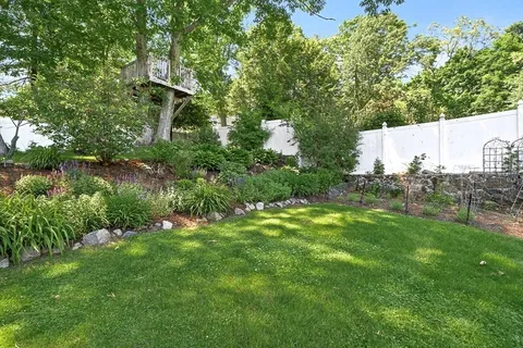 a backyard of a house with lots of green space