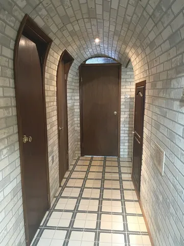 a living room with a couch and a window