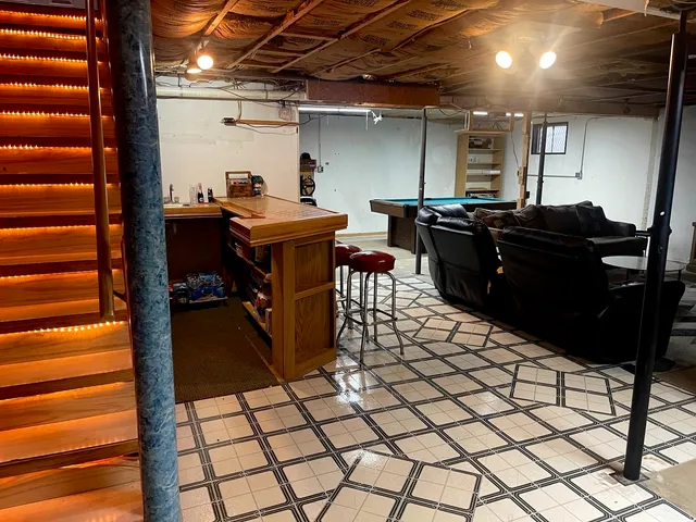 a view of a kitchen with a table and chairs