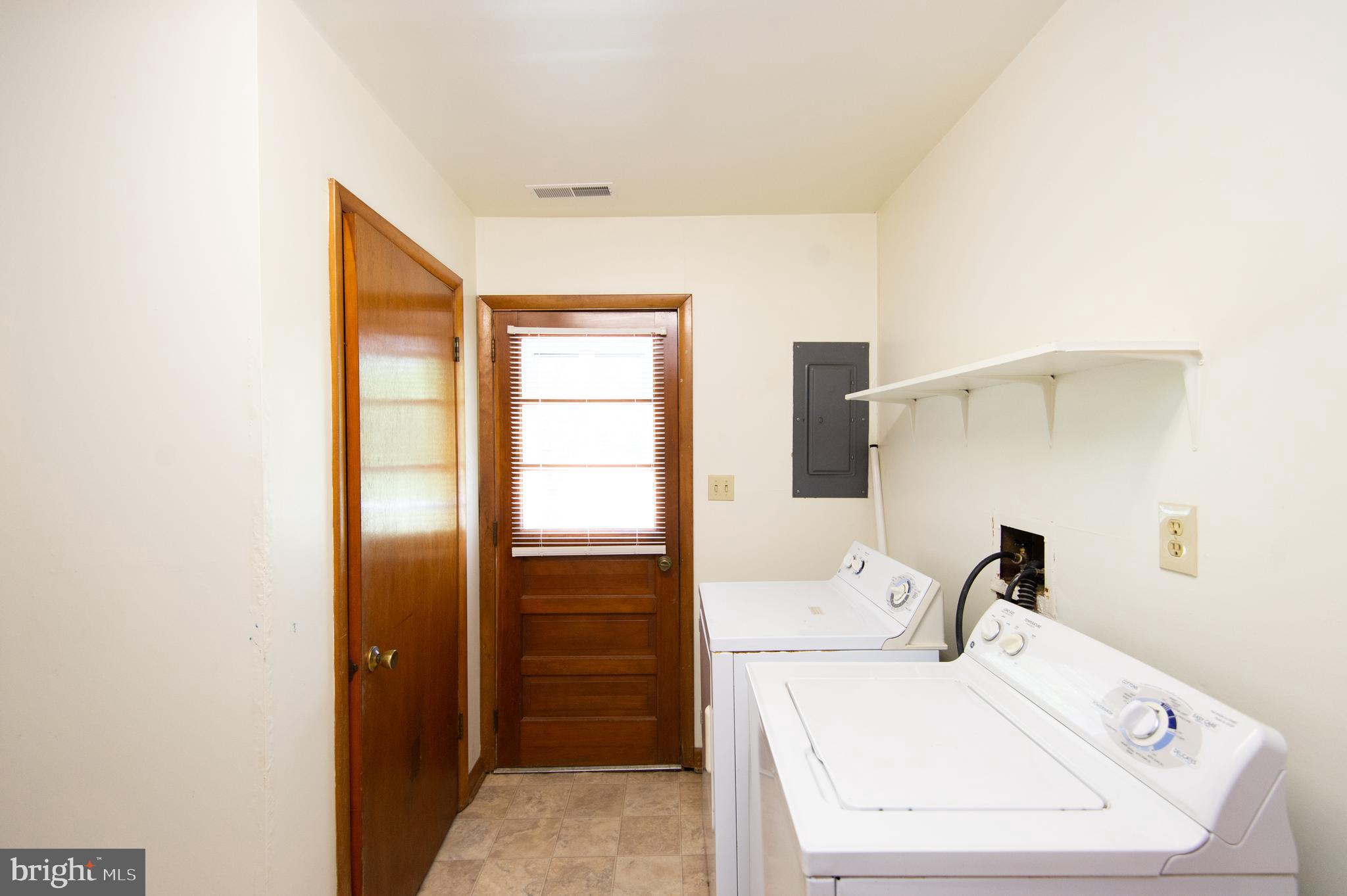 1013 Hudson Road Cambridge, MD 21613 - Photo 26 of 45 Utility Room with Washer & Dryer. Door to Backyard