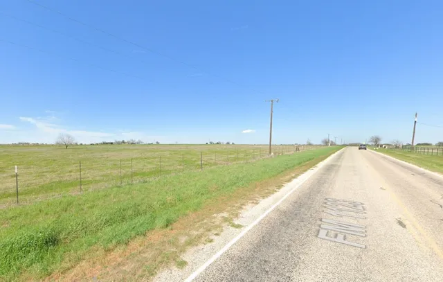 a view of a lake and a yard