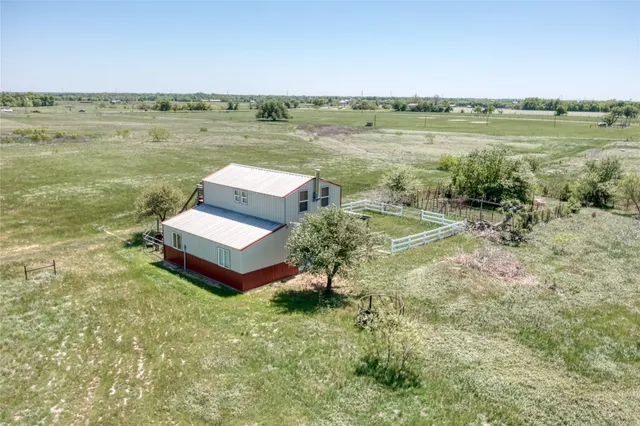 a view of a lake with a yard