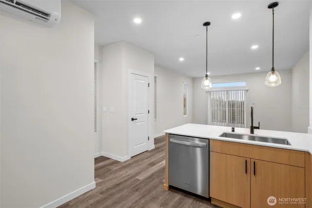 a view of room with wooden floor and fan