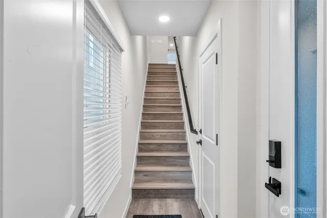 a kitchen with stainless steel appliances a refrigerator sink and microwave