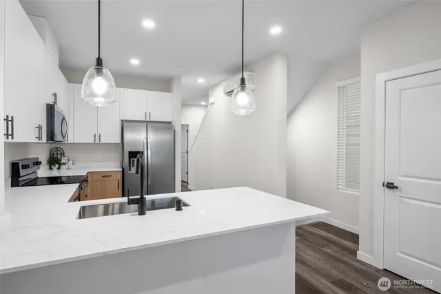 a bathroom with a sink toilet and mirror