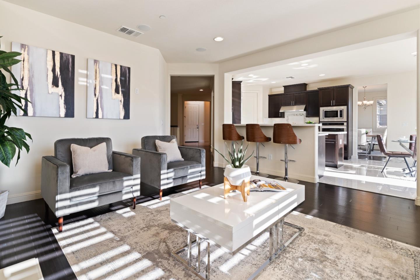 147 Elderberry Lane Brisbane, CA 94005 - Photo 17 of 56 a living room with furniture a flat screen tv and kitchen view