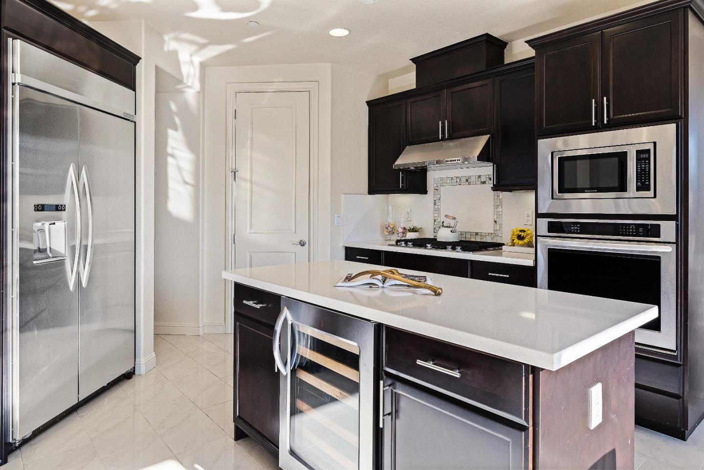 147 Elderberry Lane Brisbane, CA 94005 - Photo 18 of 56 a kitchen with a refrigerator stove and cabinets