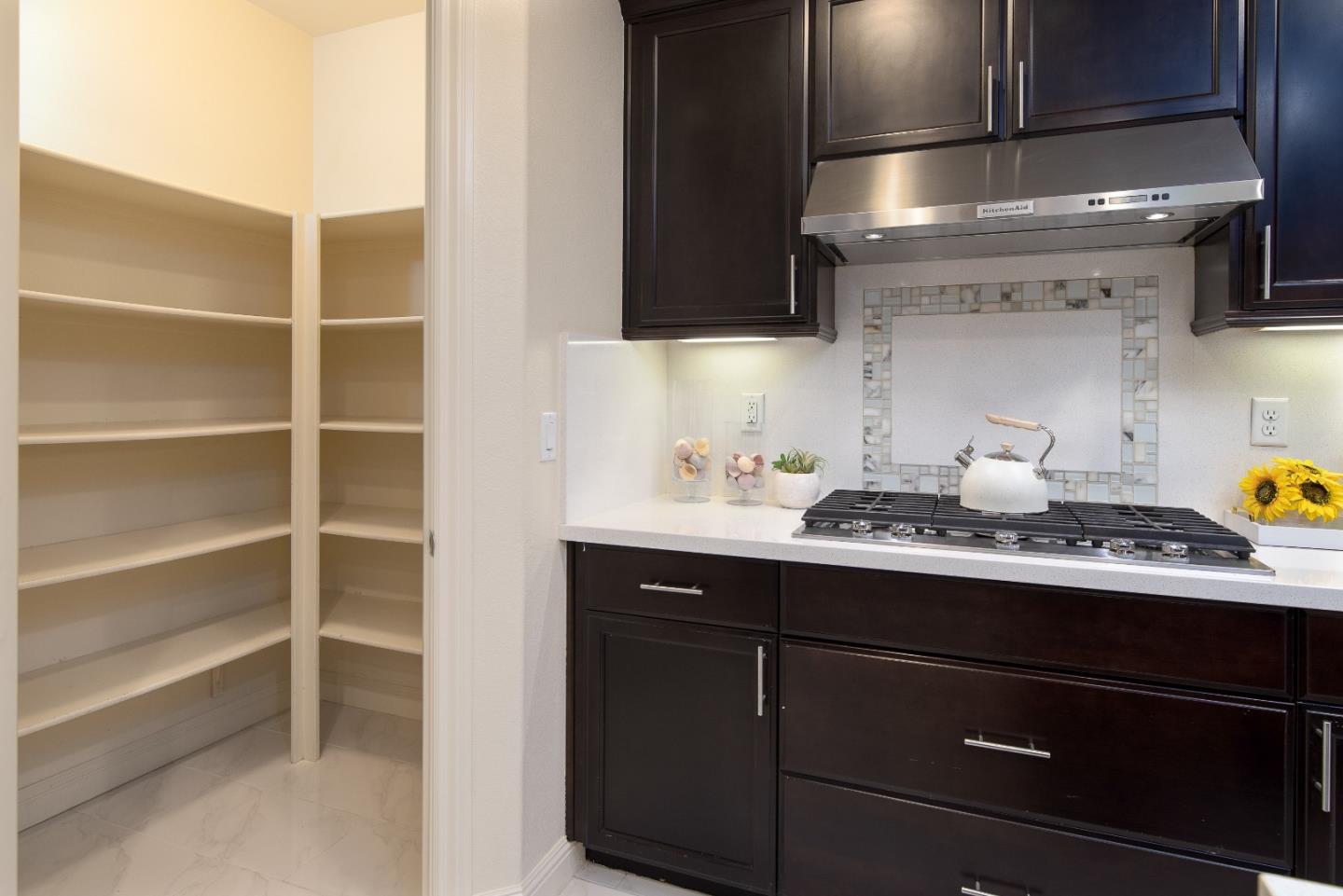 147 Elderberry Lane Brisbane, CA 94005 - Photo 19 of 56 a kitchen with a sink and cabinets