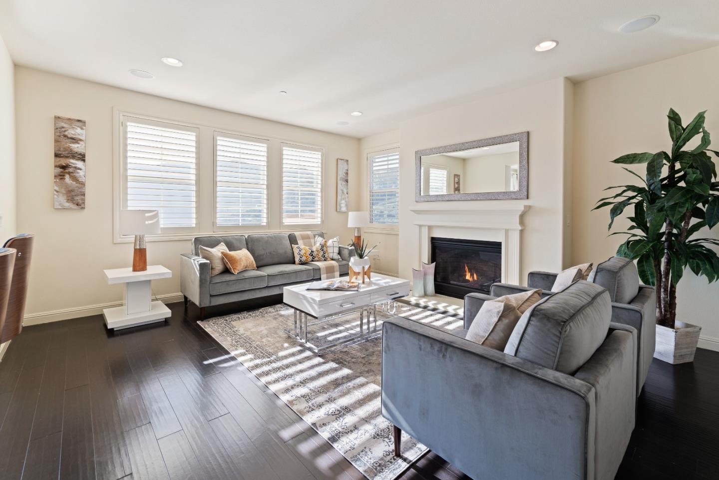 147 Elderberry Lane Brisbane, CA 94005 - Photo 20 of 56 a living room with furniture and a fireplace