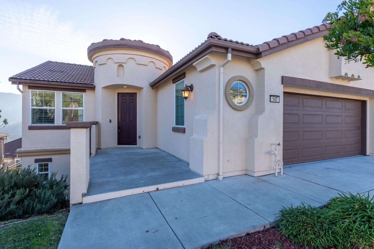 147 Elderberry Lane Brisbane, CA 94005 - Photo 2 of 56 a front view of a house with garden